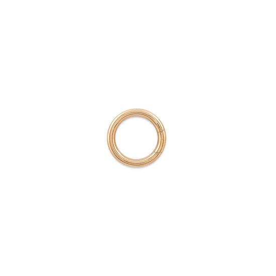 Gold round invisible clasp on a white background