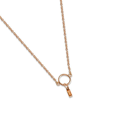 Delicate gold necklace on a white background