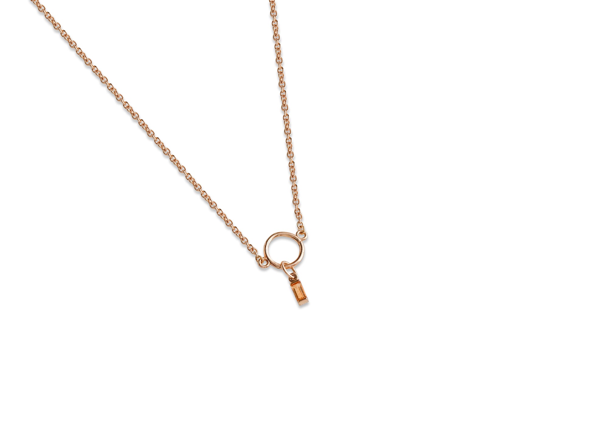 Delicate gold necklace on a white background