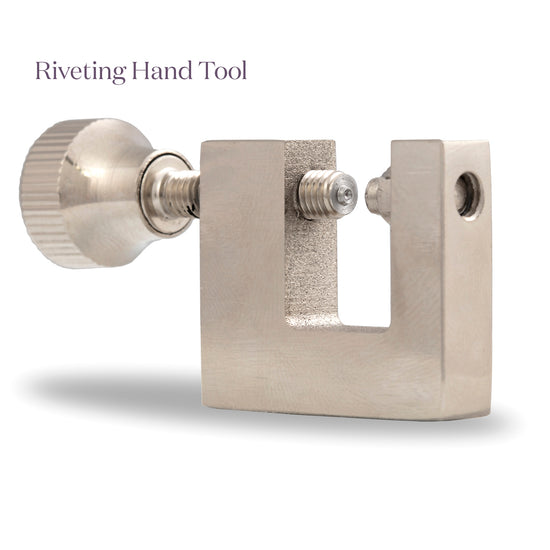 Metal riveting hand tool on a white background