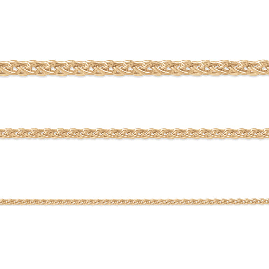 A set of three 14K yellow gold wheat chains with different thicknesses, displayed horizontally.
