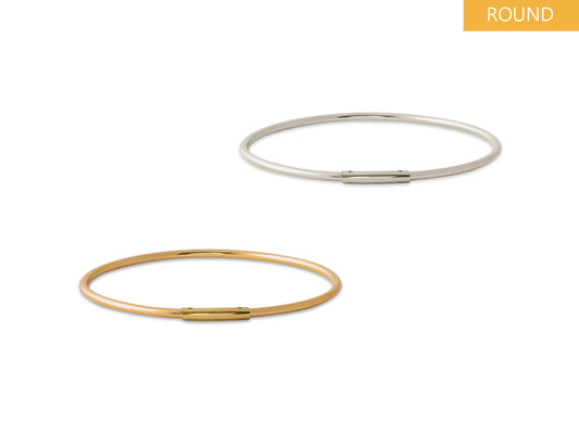 Two gold and silver permanent bangles on a white background - RIVA Precision