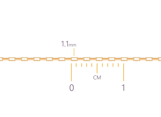 Gold elongated box chain with measurement scale showing  1.1mm length