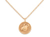 Gold necklace with a round pendant on a white background