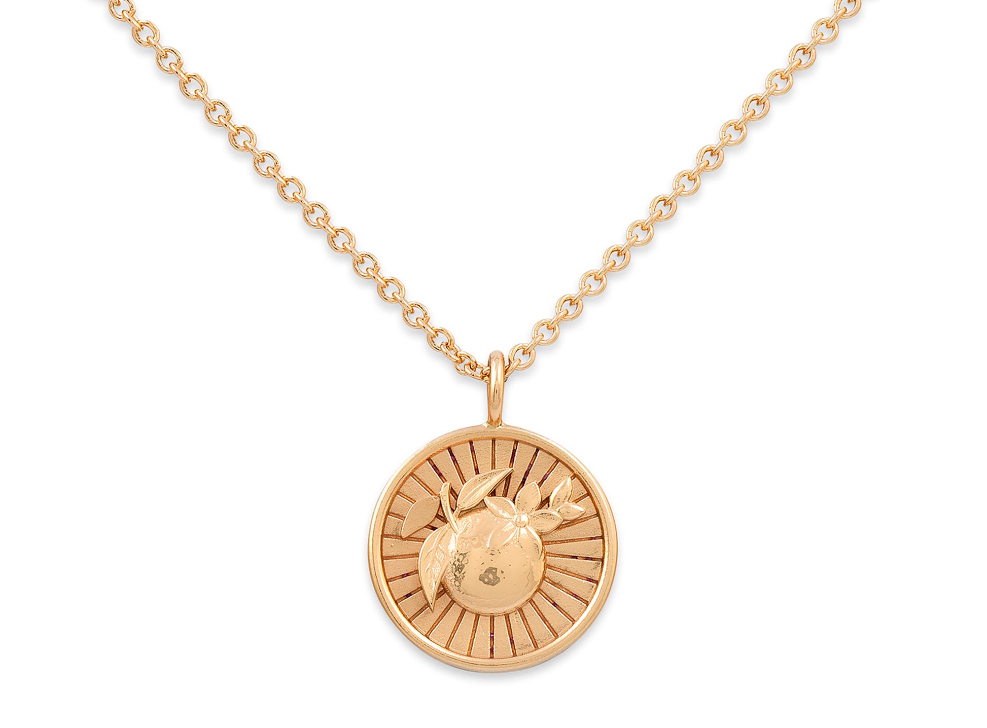 Gold necklace with a round pendant on a white background