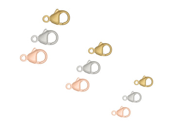 Set of gold, silver, and rose gold lobster clasps on a white background