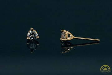 A single 3-prong fairmined gold stud earring mounting against a black background, designed to hold a 3.8mm round stone.