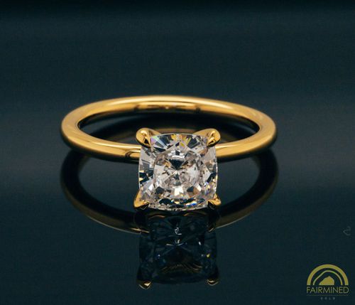 Photo of Cushion Diamond Solitaire Engagement Ring Mounting in Fairmined Yellow Gold from RIVA Precision