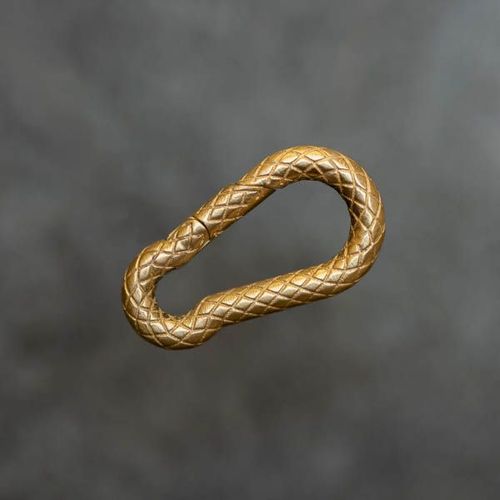 Carabiner-Shaped Invisible Clasp in snakeskin textured yellow gold from RIVA Precision