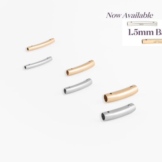 Set of gold, silver, and rose gold bar jewelry on a white background